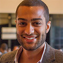 A Smiling man with bald hairs